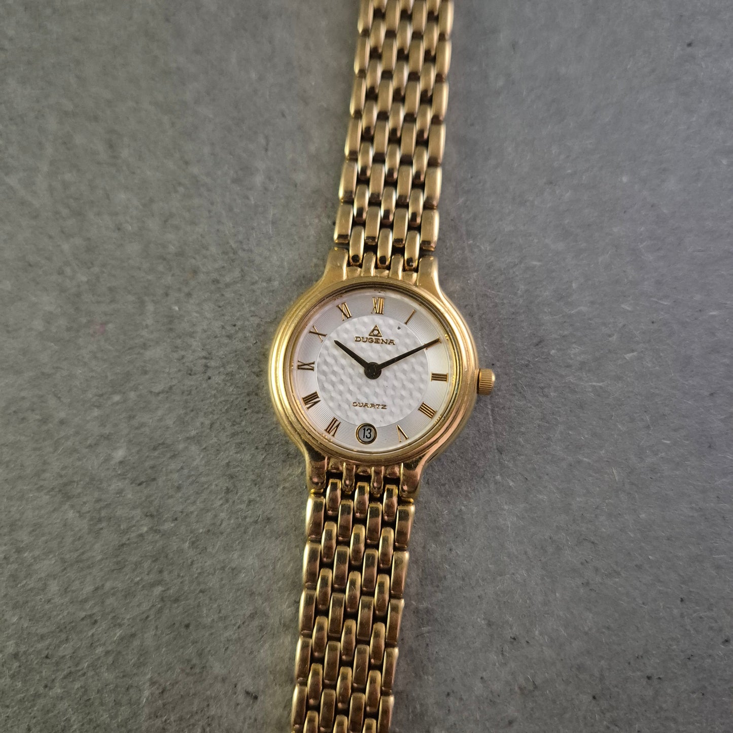 Damen Uhr Dugena Quartz Gold mit römischen Ziffern und Datumsanzeige