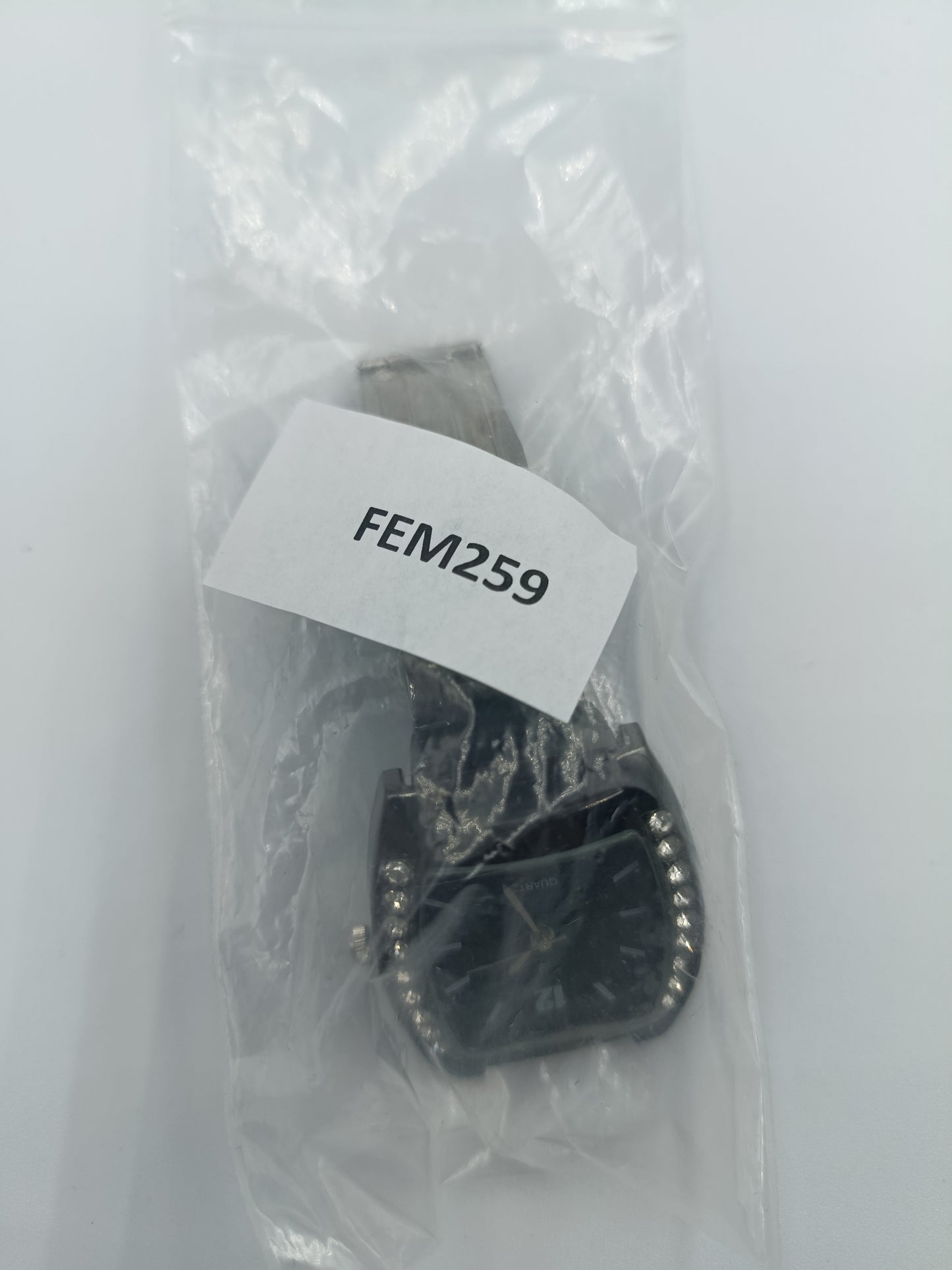 Schwarze Quarzuhr mit Strassbesatz