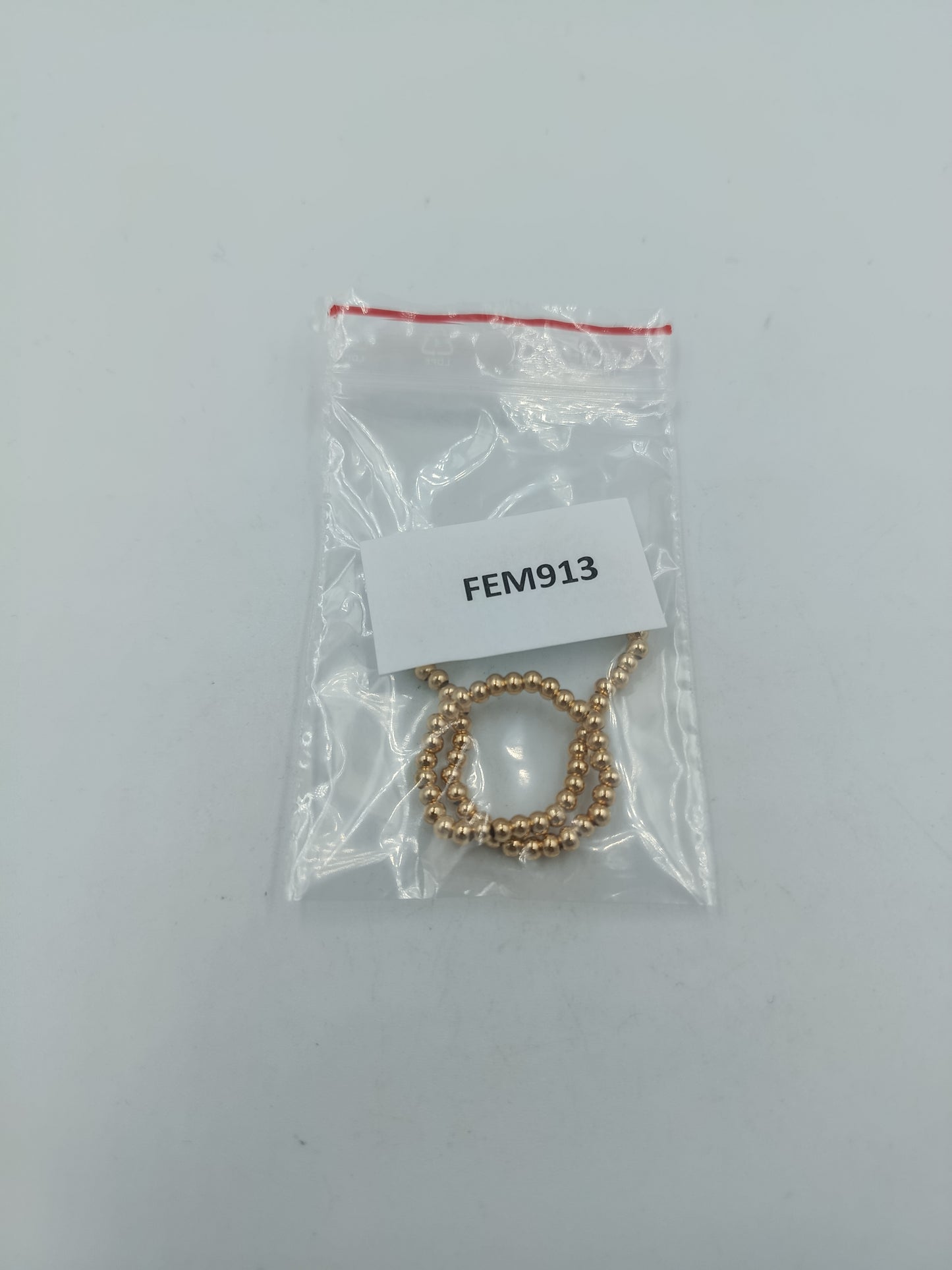 Feines elastisches Armband mit goldfarbenen Mini-Kugeln