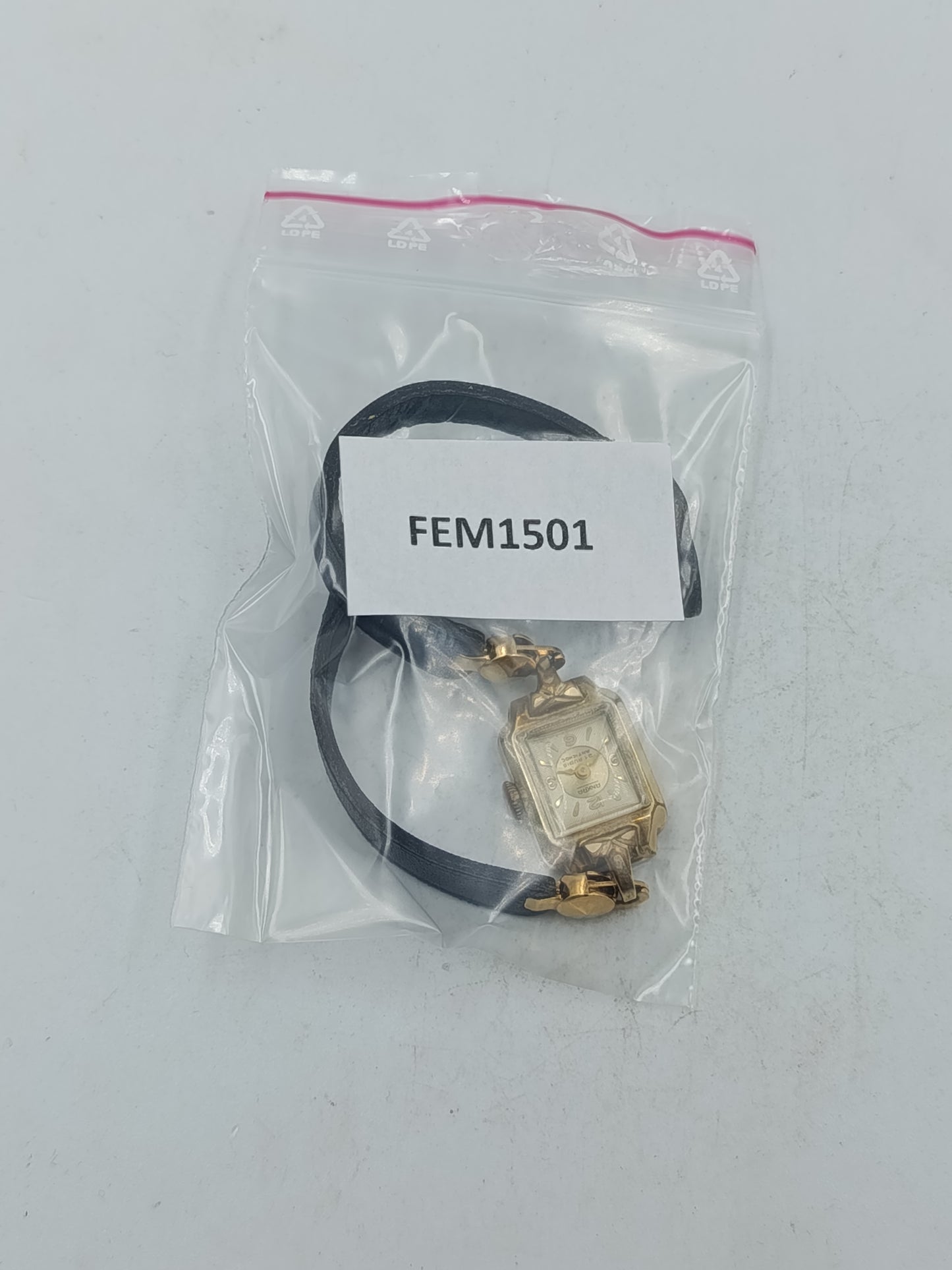 Goldfarbene Armbanduhr mit schwarzem Lederband Seiko Quartz