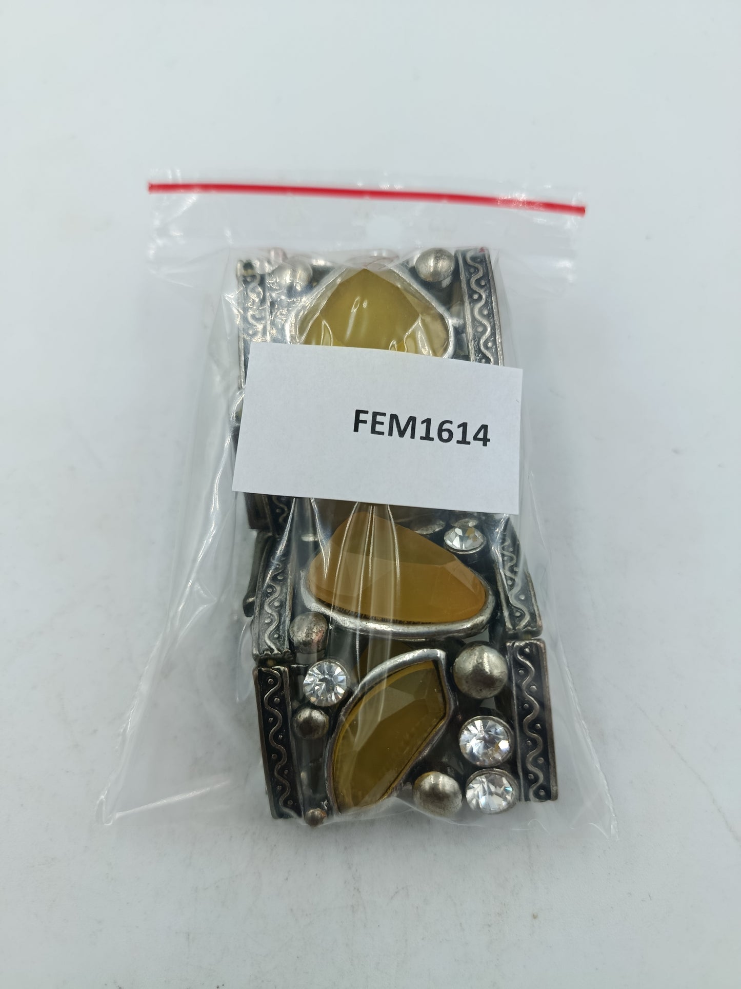Auffälliges elastisches Armband mit gelben Schmucksteinen