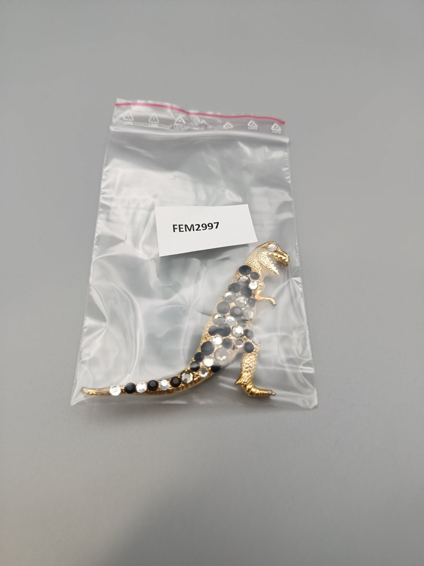 Modische T-Rex Dinosaurier Brosche in Goldoptik