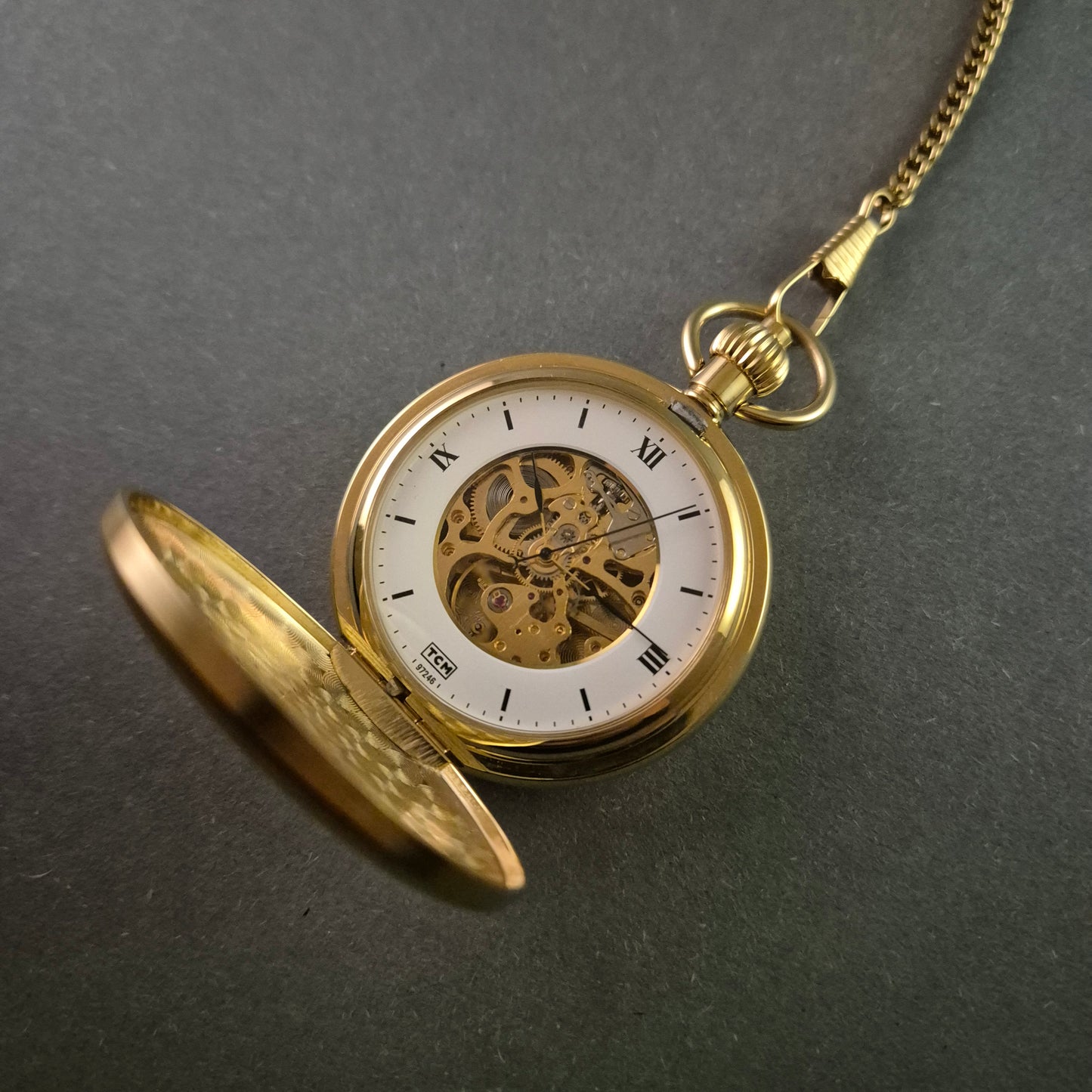 TCM Taschenuhr – Eleganter Skelettmechanismus mit Vergoldung