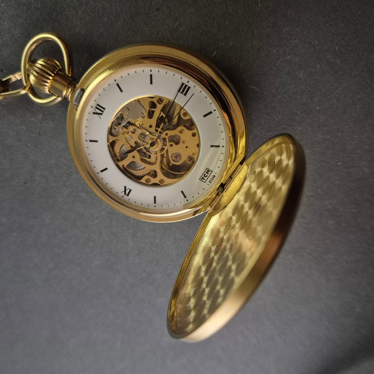 TCM Taschenuhr – Eleganter Skelettmechanismus mit Vergoldung