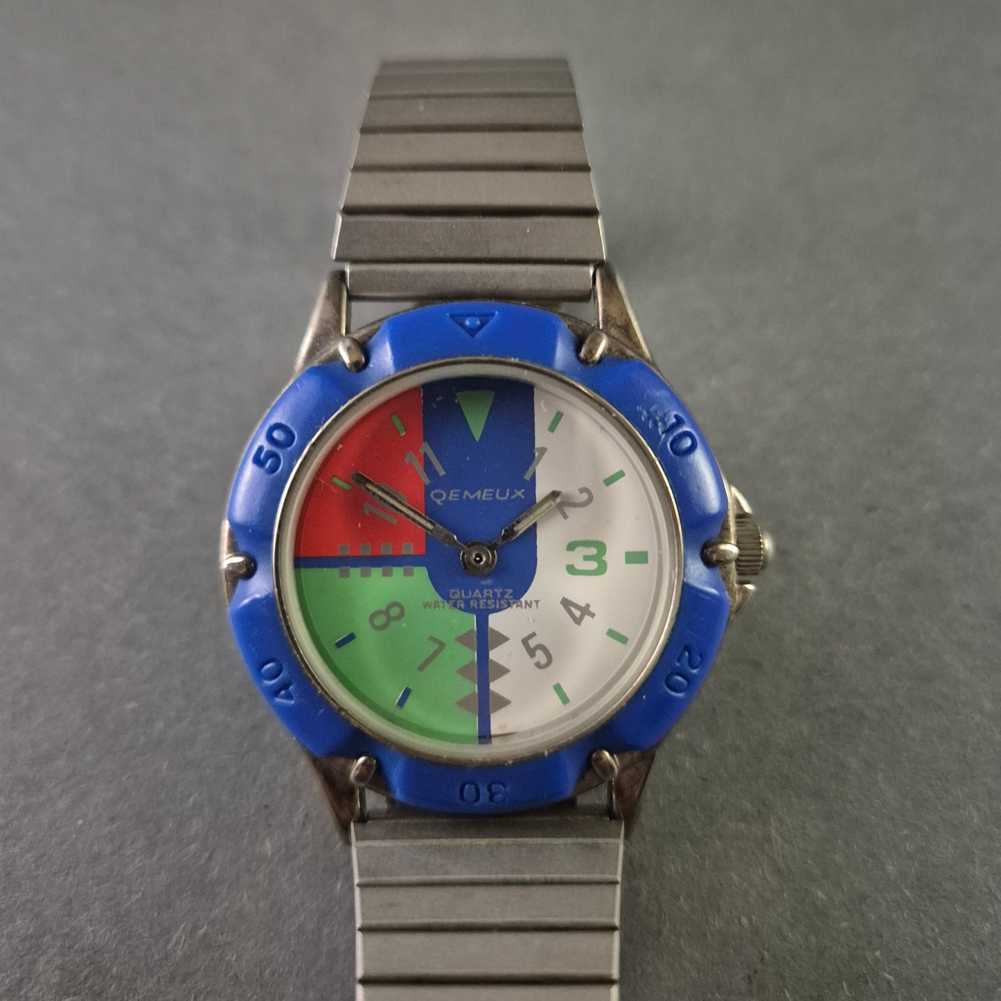 Seltene Qemeux Herrenarmbanduhr – Buntes Design mit Edelstahlarmband