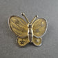 Vintage Schmetterlings-Brosche – Filigrane Goldoptik mit Blütenmuster