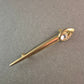 Elegante goldfarbene Brosche mit Strass-Stein