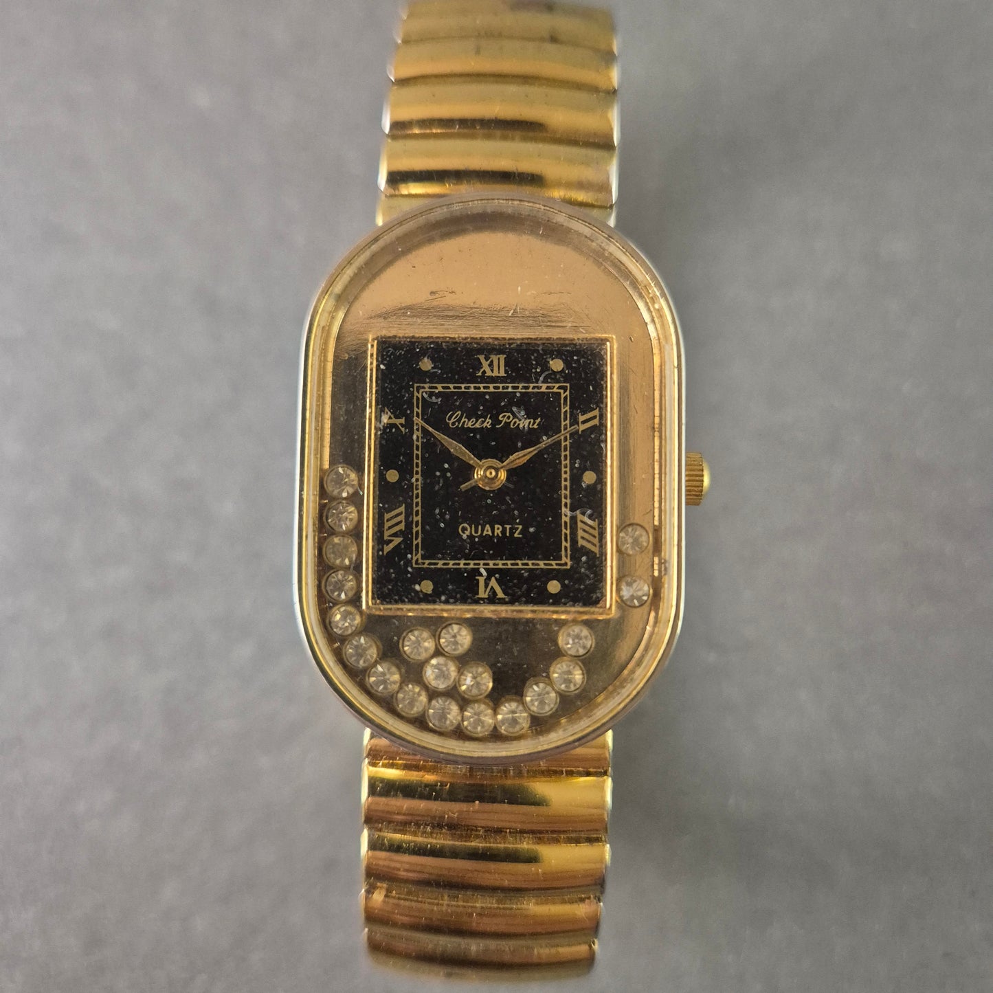 Elegante Check Point Damenarmbanduhr – Goldfarben mit funkelnden Steinen
