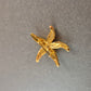 Goldene Seestern-Brosche – Maritimer Vintage-Chic