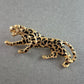Elegante Panther-Brosche – Goldfarbener Look mit schwarzem Muster