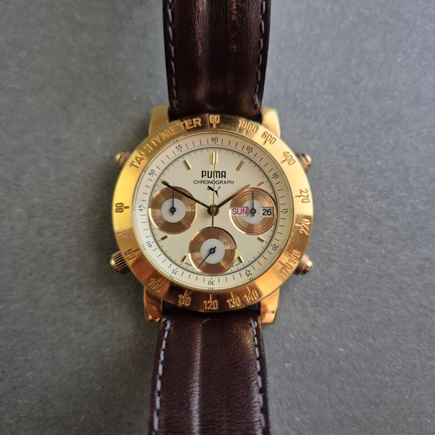 Sportliche Puma Uhr Herrenarmbanduhr – Vergoldeter Chronograph mit Tachymeter