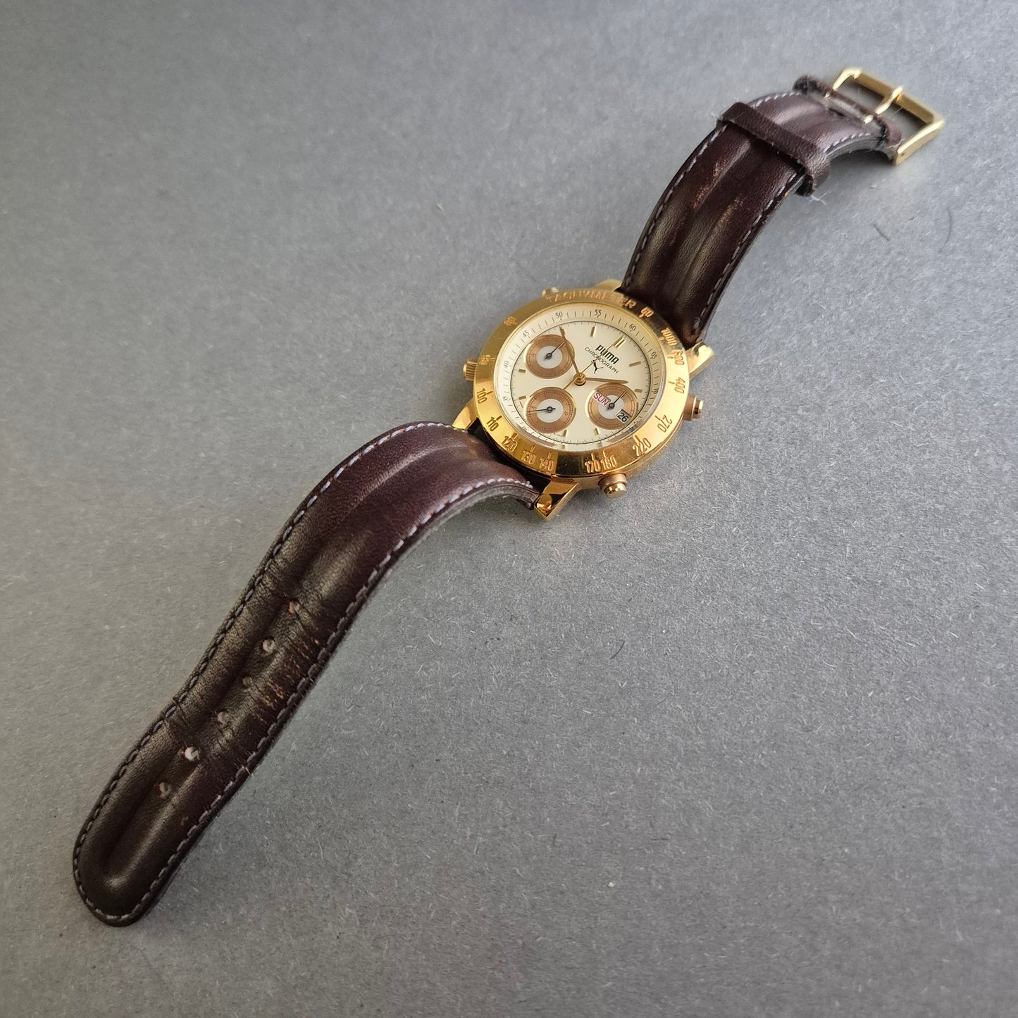 Sportliche Puma Uhr Herrenarmbanduhr – Vergoldeter Chronograph mit Tachymeter