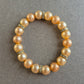 Elastisches Perlenarmband mit Strass – Champagnerfarbene Eleganz