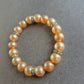 Elastisches Perlenarmband mit Strass – Champagnerfarbene Eleganz