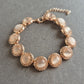 Roségoldfarbenes Strassarmband – Mit schimmernden Cabochon-Steinen