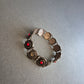 Vintage-Armband mit roten Steinen und Zierspiralen