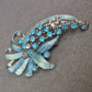 Vintage-Brosche mit türkisfarbenen Strasssteinen und Emailleblättern