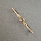 Zarte Vintage Anstecknadel in Goldoptik mit Kristallstein
