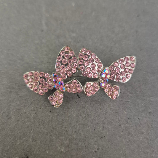 Glitzernde Schmetterlingsbrosche mit rosa Strasssteinen