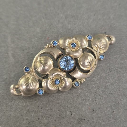 Antike florale Brosche mit blauen Strasssteinen – Eleganz im Jugendstil