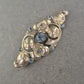 Antike florale Brosche mit blauen Strasssteinen – Eleganz im Jugendstil