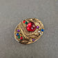 Bunte Vintage-Brosche im Barockstil – Glaskabochon & Strasssteine