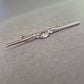 Elegante Vintage-Brosche aus Silber mit funkelndem Steinbesatz