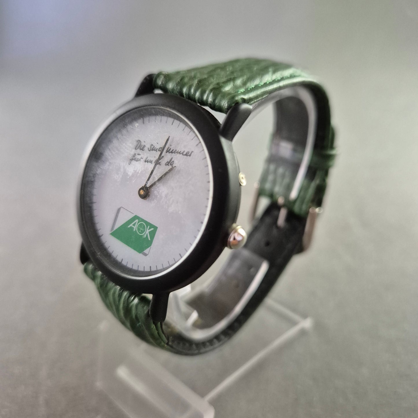 Seltene AOK Quarz Uhr – Werbeuhr mit grünem Lederarmband