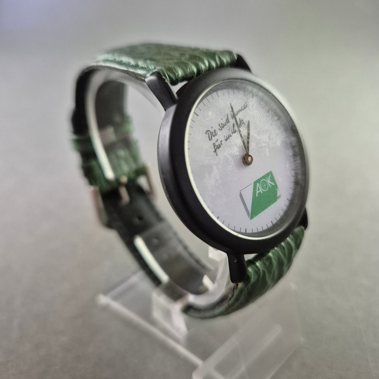 Seltene AOK Quarz Uhr – Werbeuhr mit grünem Lederarmband