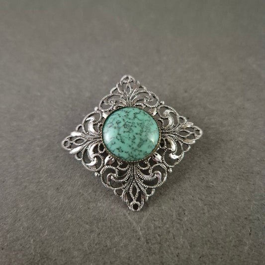 Vintage Anstecknadel mit türkisfarbener Mitte im filigranen Design