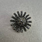 Schwarze Vintage-Brosche im Sonnenstrahl-Design – Funkelnder Strass