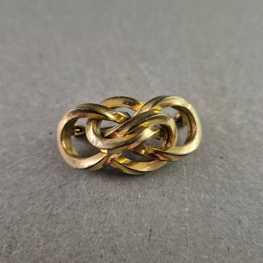 Antike Knoten-Brosche aus Messing – Verschlungene Ringoptik