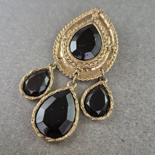 Opulente Vintage-Brosche mit schwarzen Ziersteinen