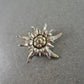 Vintage Edelweiss Brosche – Silberfarben mit Goldakzent