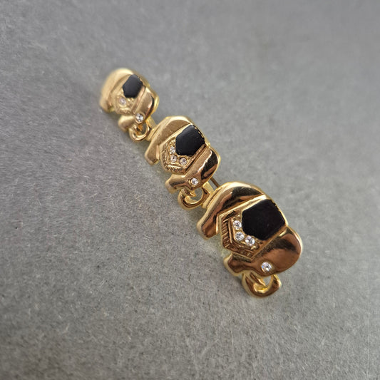 Vintage Brosche Elefantenreihe – Goldfarben, Schwarz & Strass