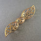 Filigrane Brosche in Goldoptik – Ornamentales Design