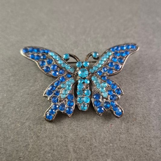 Schmetterlings Brosche mit blauen Strasssteinen – Funkelndes Vintage-Design
