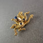 Goldfarbene Kraken Brosche mit blauen Steinen – Maritimer Eyecatcher