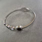 Elegantes Armreif Armband mit Kristallen und schwarzem Inlay