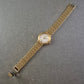 Damen Uhr Dugena Quartz Gold mit römischen Ziffern und Datumsanzeige