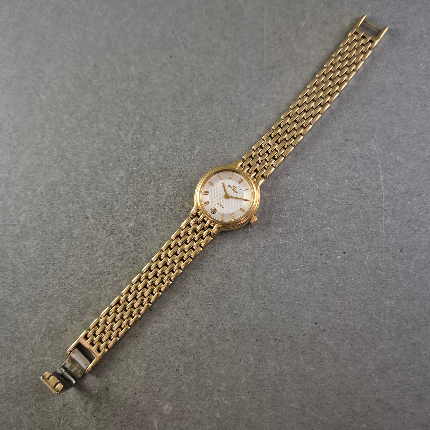 Damen Uhr Dugena Quartz Gold mit römischen Ziffern und Datumsanzeige