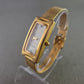Elegante Damen Uhr mit rechteckigem Gehäuse und Milanaise-Band