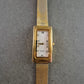 Elegante Damen Uhr mit rechteckigem Gehäuse und Milanaise-Band