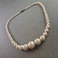 Elegante Perlenkette mit abnehmendem Durchmesser