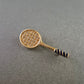 Vergoldete Tennisbrosche mit Strass – Sportlich und funkelnd