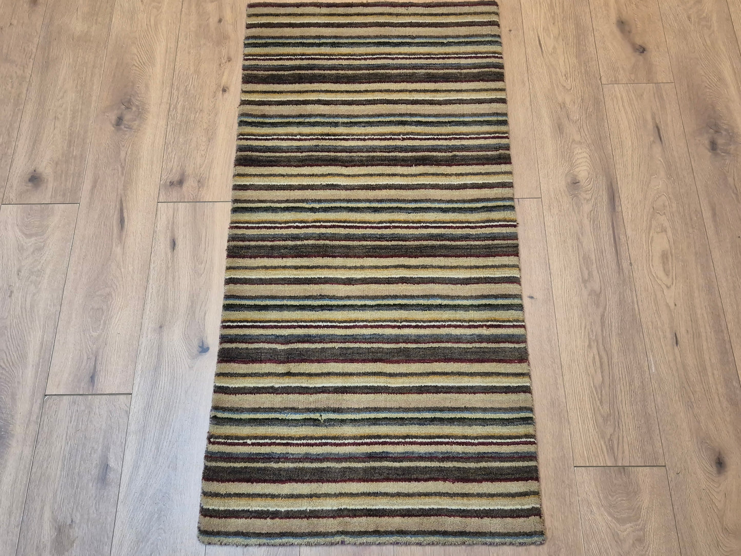 Perser Gabbeh Teppich Schurwolle Streifenmuster erdige Farbpalette