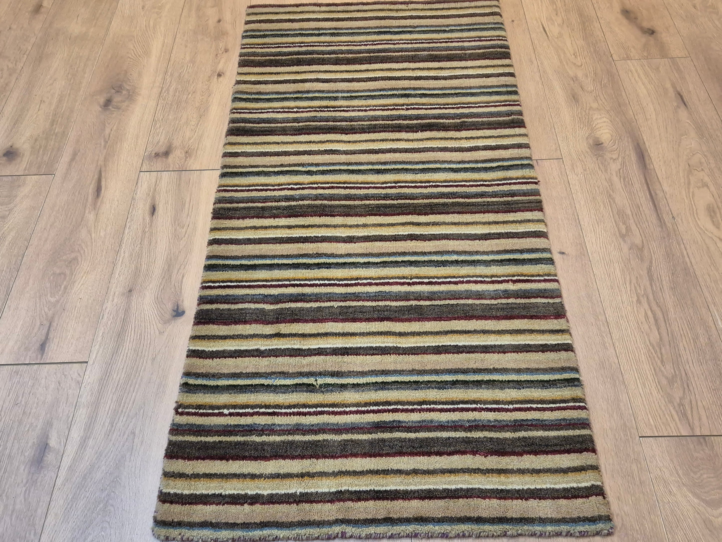 Perser Gabbeh Teppich Schurwolle Streifenmuster erdige Farbpalette