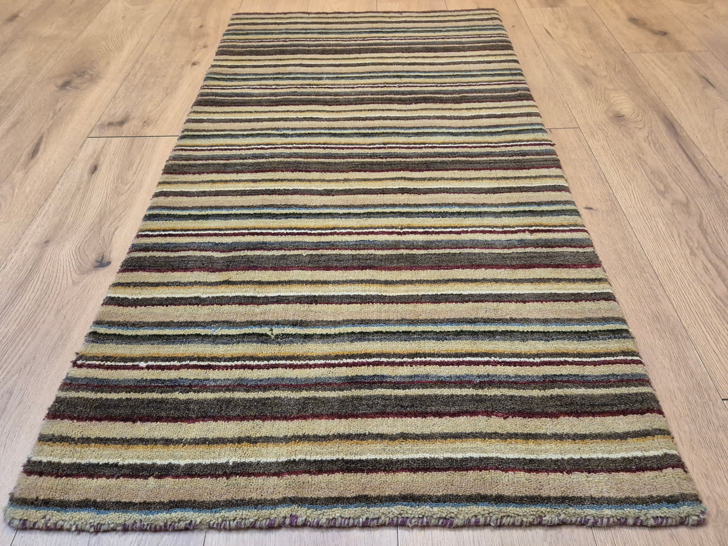 Perser Gabbeh Teppich Schurwolle Streifenmuster erdige Farbpalette