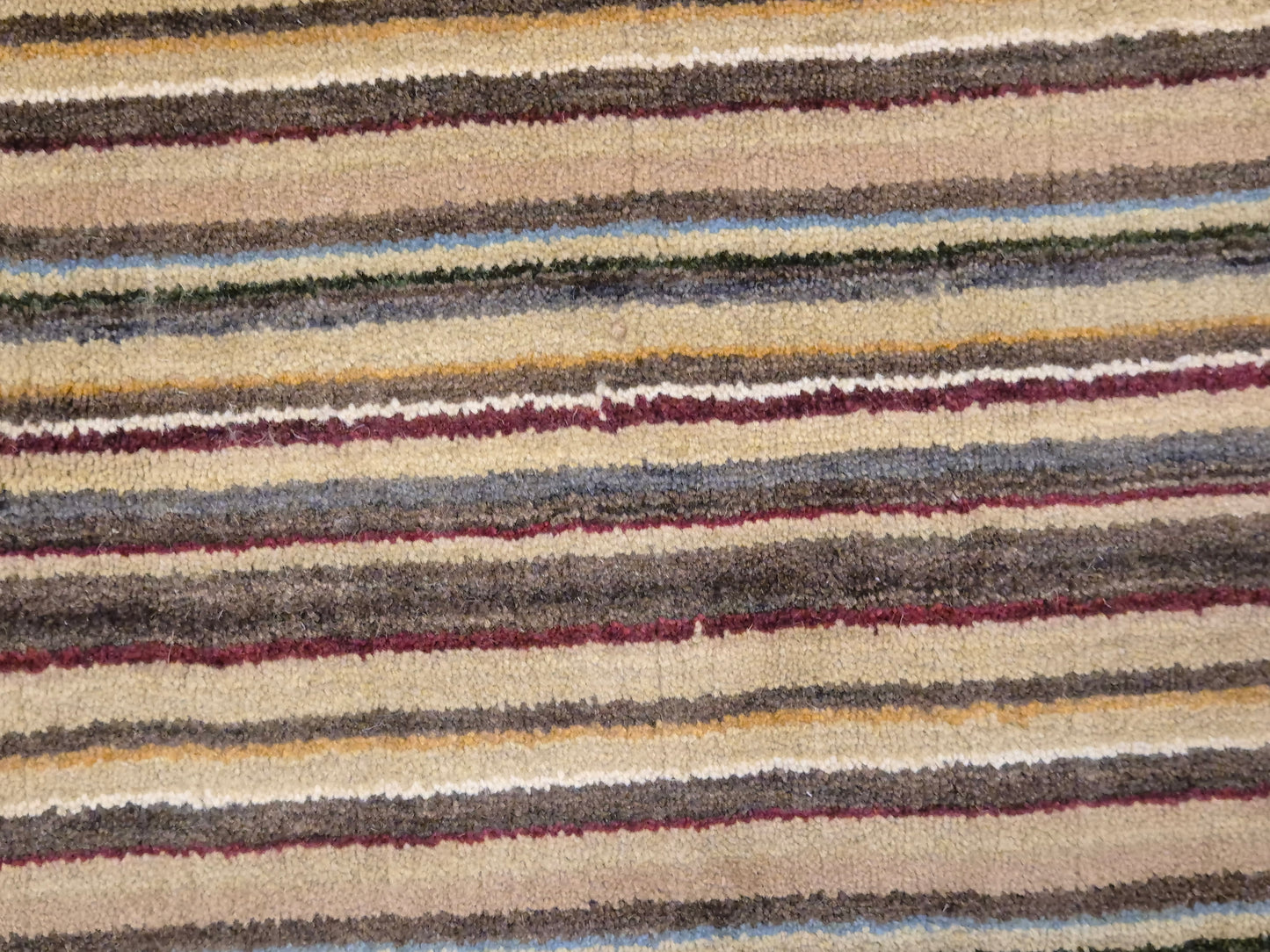 Perser Gabbeh Teppich Schurwolle Streifenmuster erdige Farbpalette