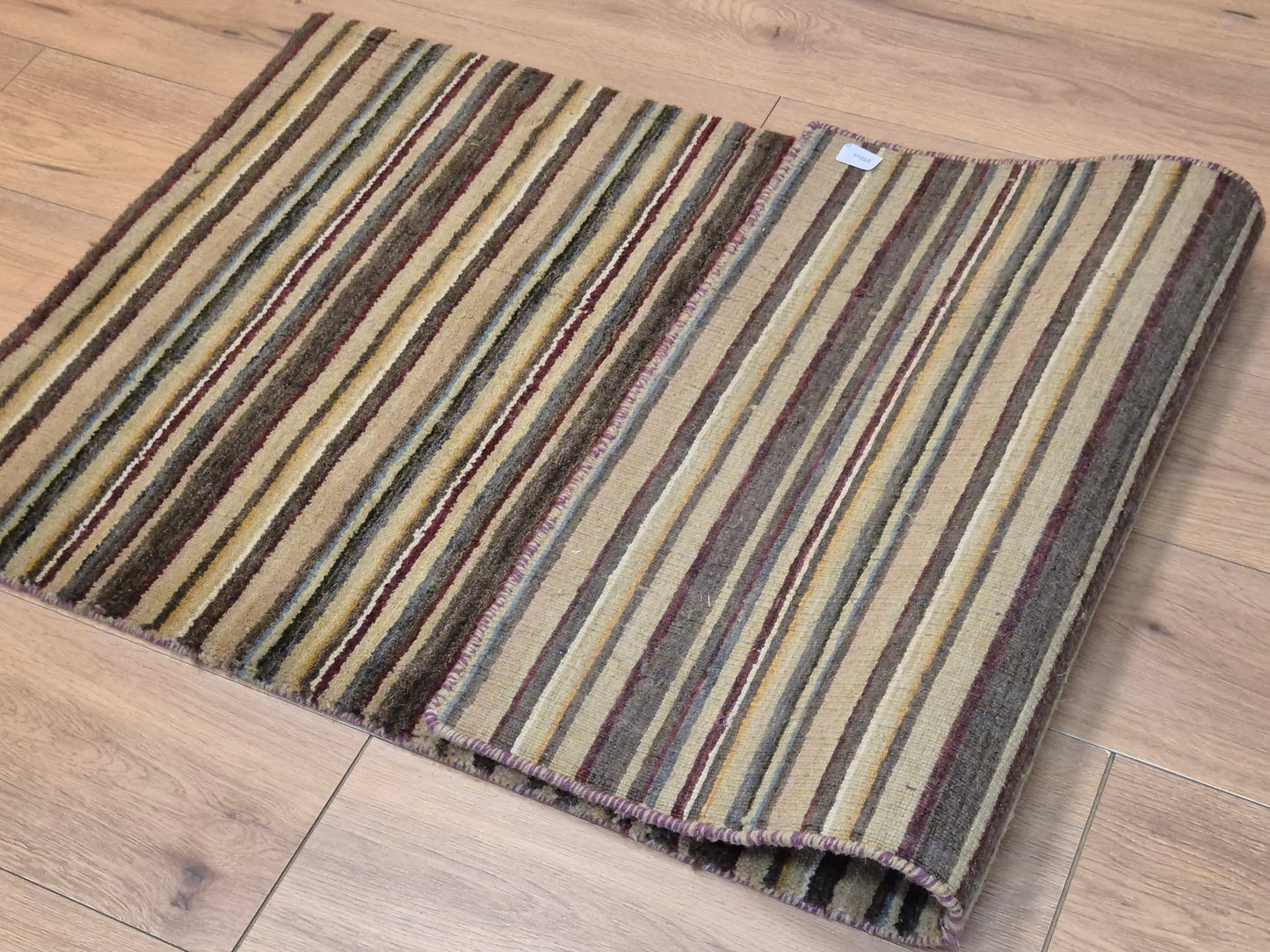 Perser Gabbeh Teppich Schurwolle Streifenmuster erdige Farbpalette